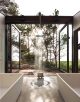 Badrumsinspiration - Industriellt badrum med betong, fristående badkar, spegelvägg, takfönster, badrumslampor med raster och synliga stålbalkar.
