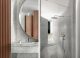 Badrumsinspiration - Tres chic badrum i Trocadero, Paris, i carrara och stor rund spegel - ritat av Françoise Champsaur.