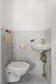 sekelskifte-badrum-inspiration_marmor-massing-toalett_grevgatan25_lagerlinds_badrumsdrommar