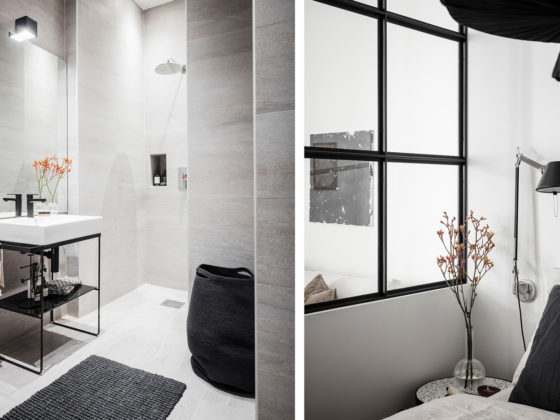 Badrumsinspiration - badrum med stora plattor och svart glasvägg