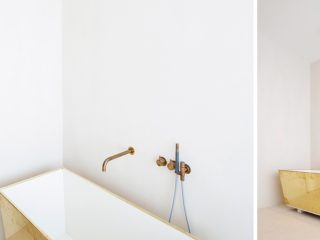 Badrumsinspiration - Minimalistiskt badrum med mässingbadkar i Antwerpen, Belgien.