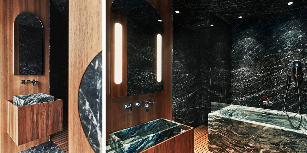 Badrumsinspiration - Modernt badrum i grön marmor med marmorbadkar och teakpanel.